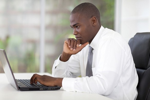 businessman concentrating at laptop